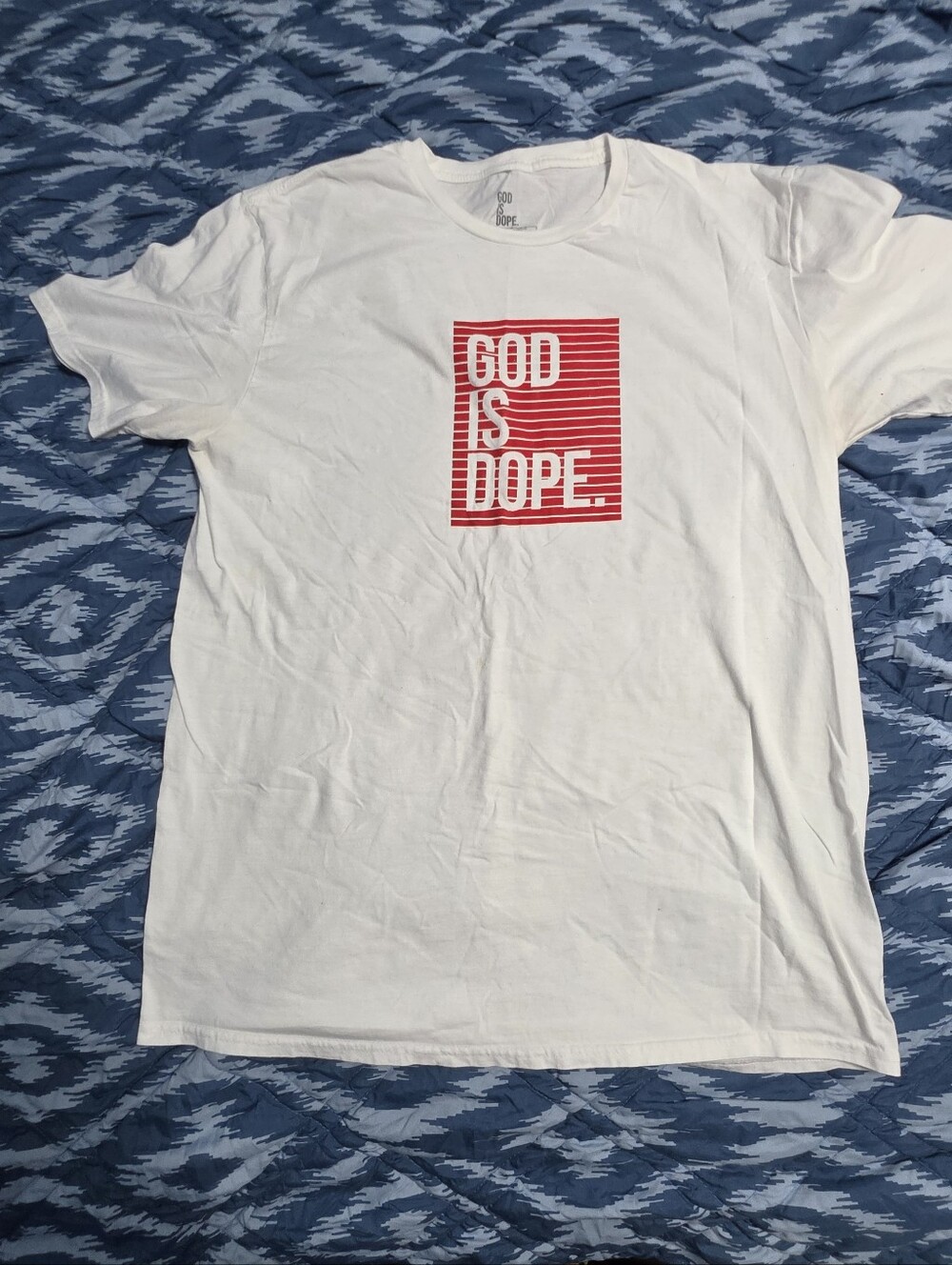 White Graphic Tee with Red 'God Is Dope' Print Size Large.